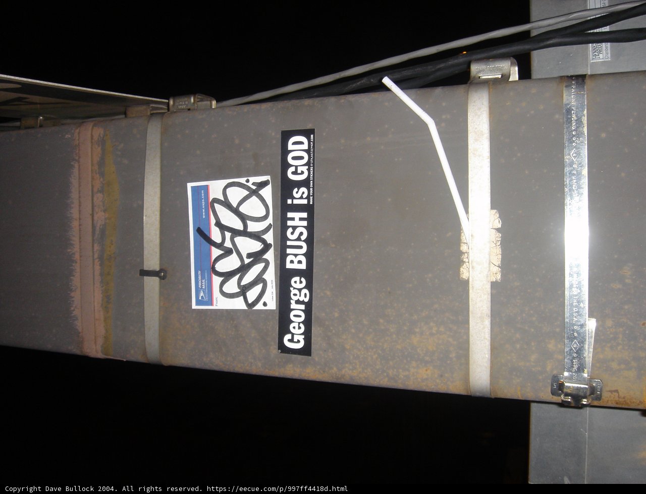 Shipping Sticker on a Metal Pole