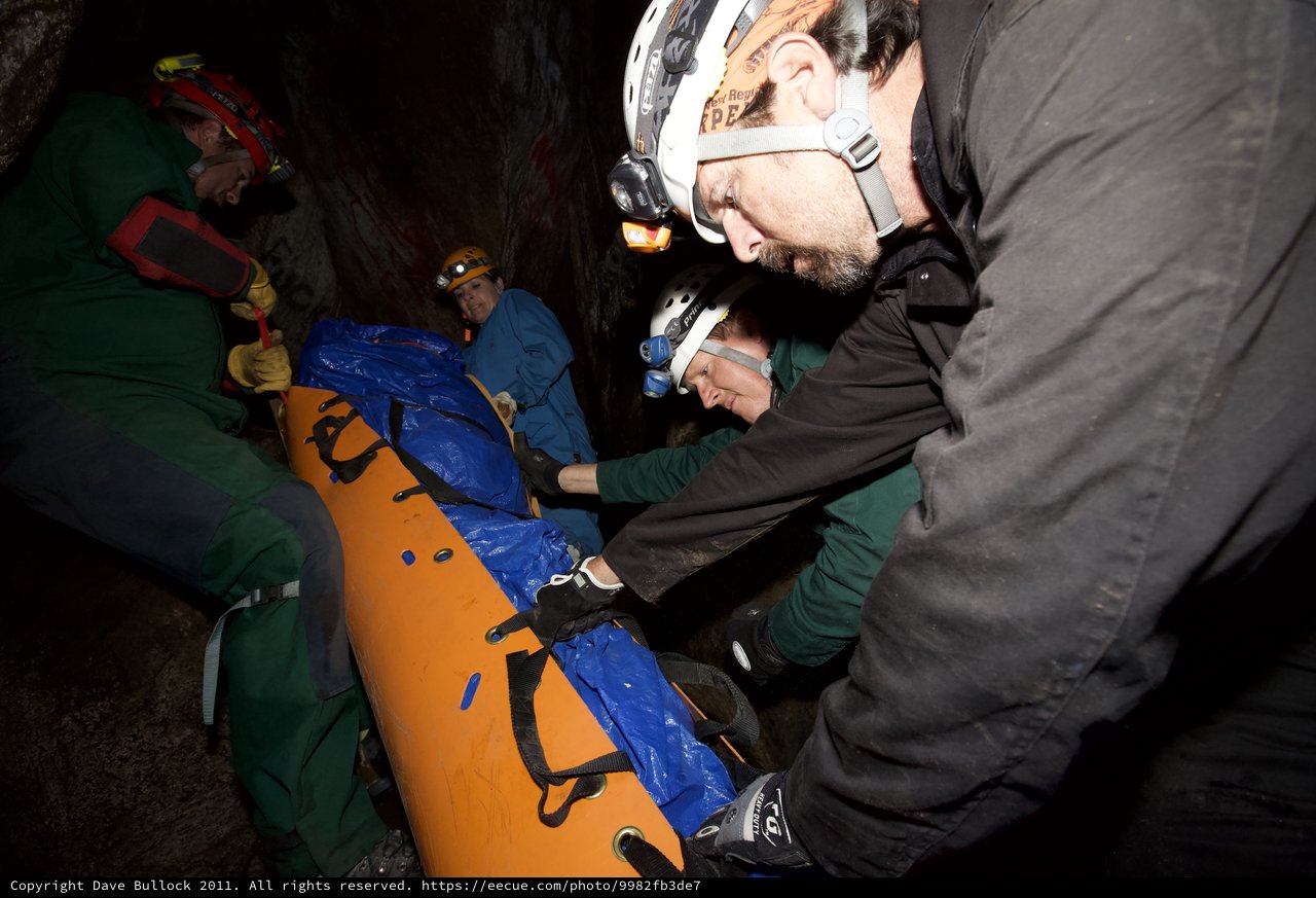 Cave Rescue Team Carries Stretcher Through Underground Passage