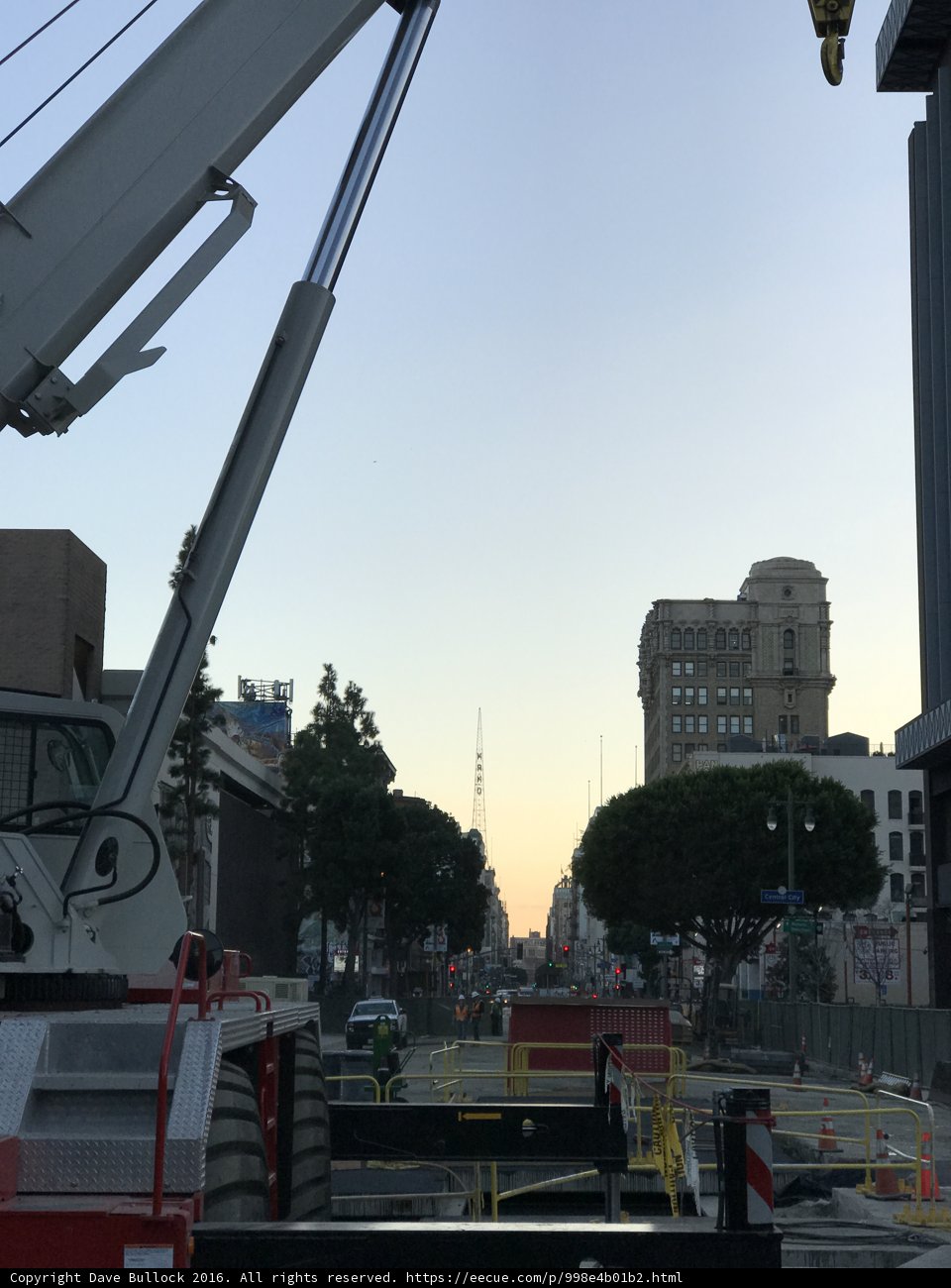 Construction Crane Lifting Equipment onto Busy Los Angeles Street