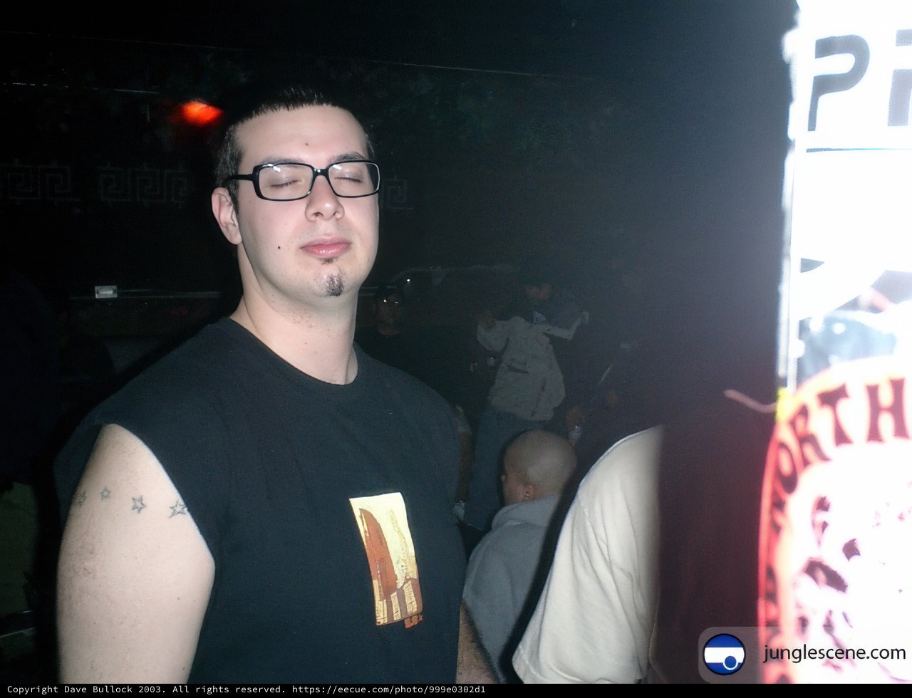 Tattooed Man in the Urban Night