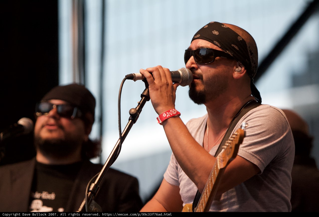 Grand Performance of Ozomatli's 2007 Concert featuring Singer with Bandana and Sunglasses