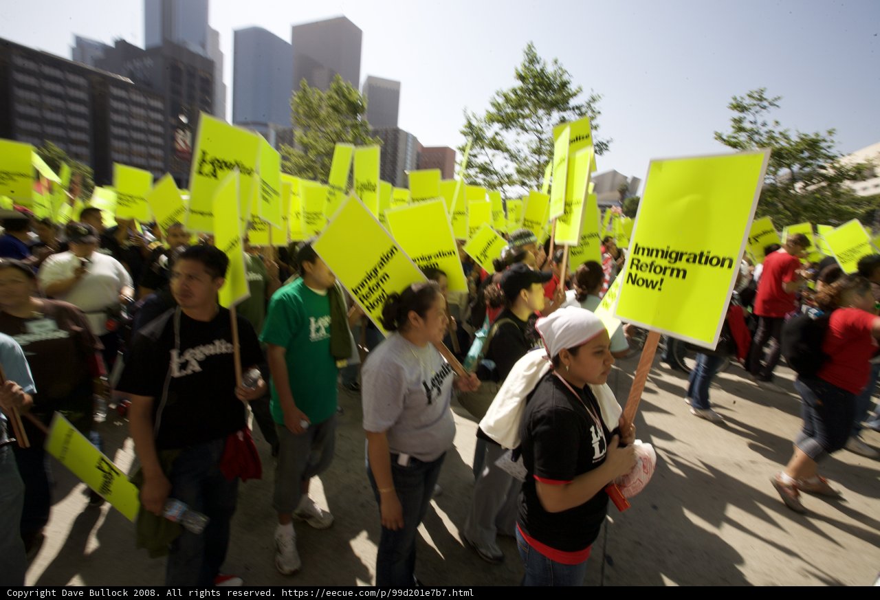 May Day Protesters March with Signs