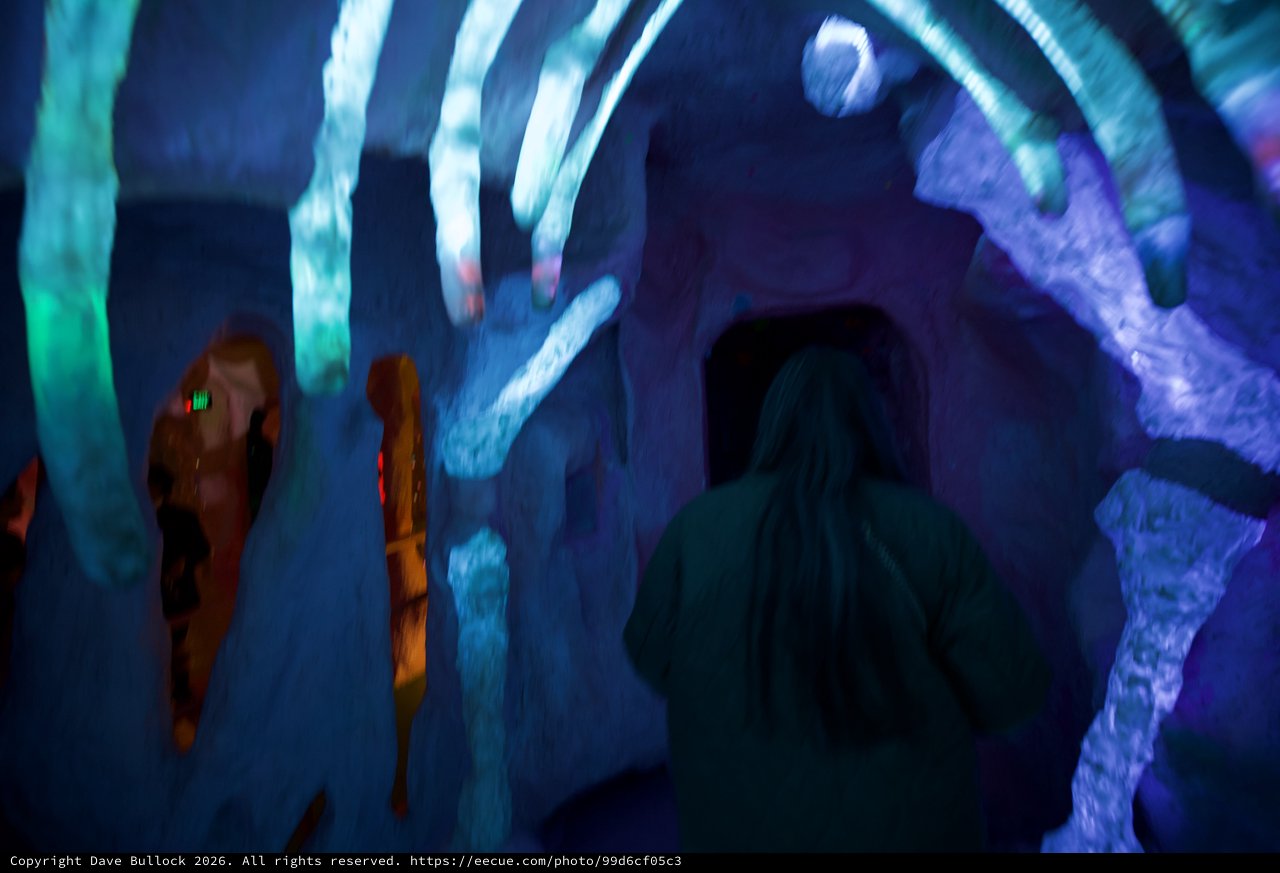 Visitors in Ice Cave with Blue Projected Light