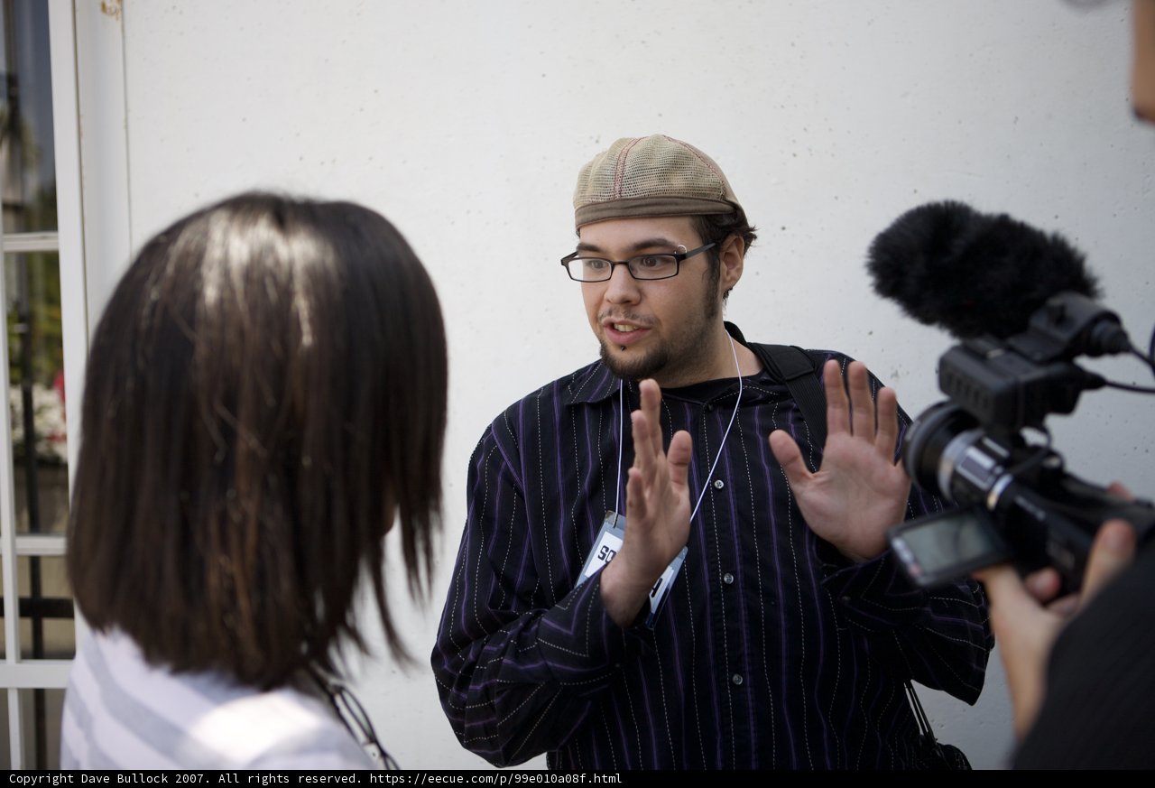 Man with a hat and camera