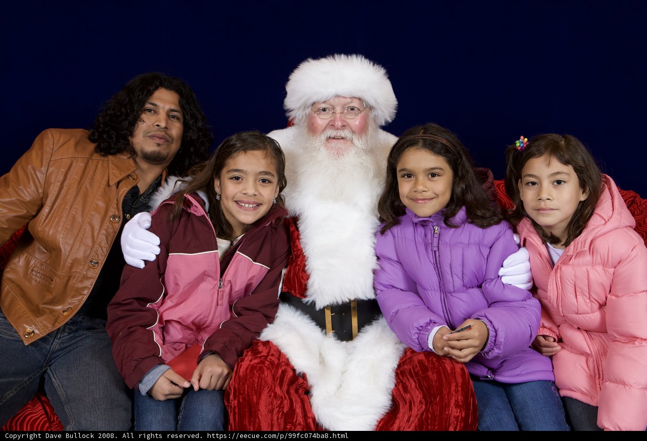Santa Claus Spreading Joy to Children at APC Xmas Party