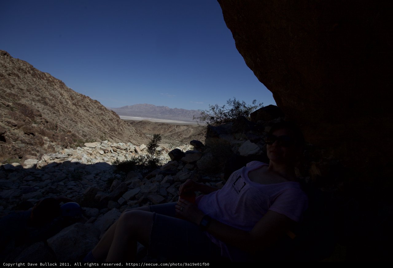 Desert Shade: Resting Under Canyon Rocks in Death Valley