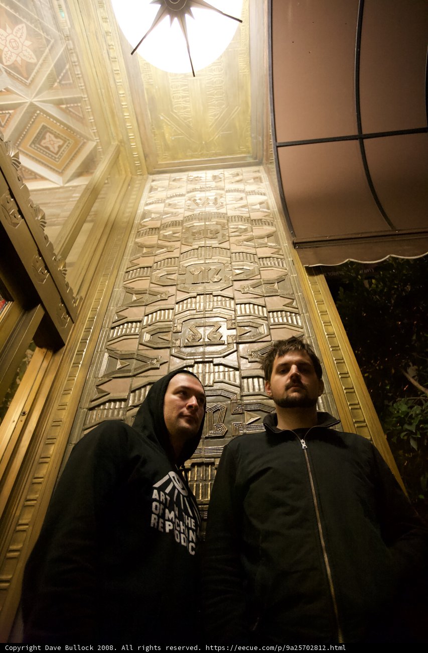 Two Men Standing Tall