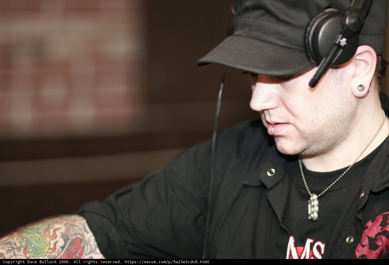 Headphone-wearing Man with Tattooed Skin