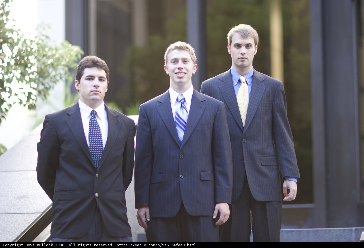 Three Men in Suits Strike a Pose