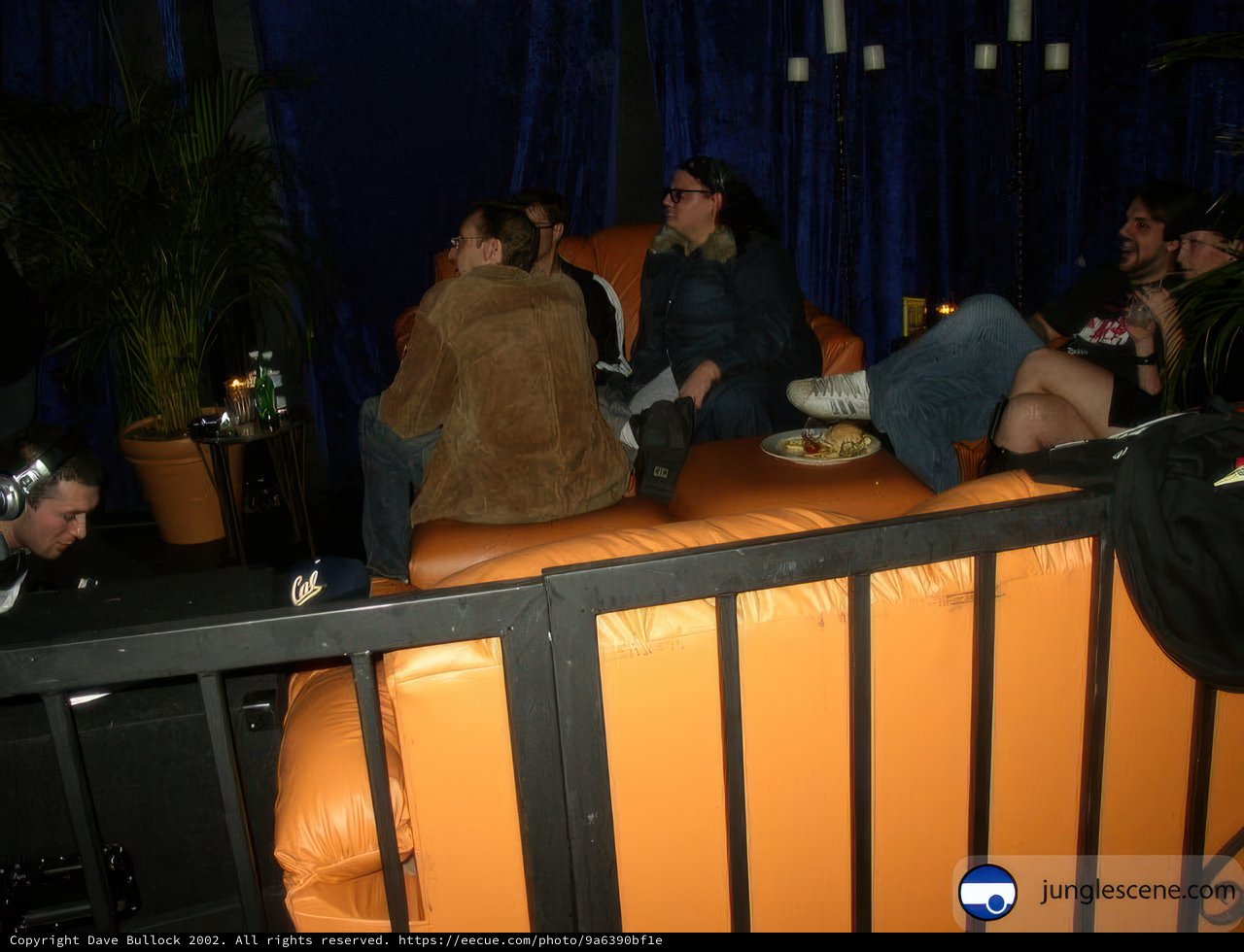 A Cozy Gathering on Orange Couches