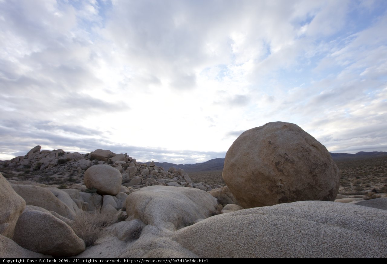 Solitary Rock in Desert Landscape