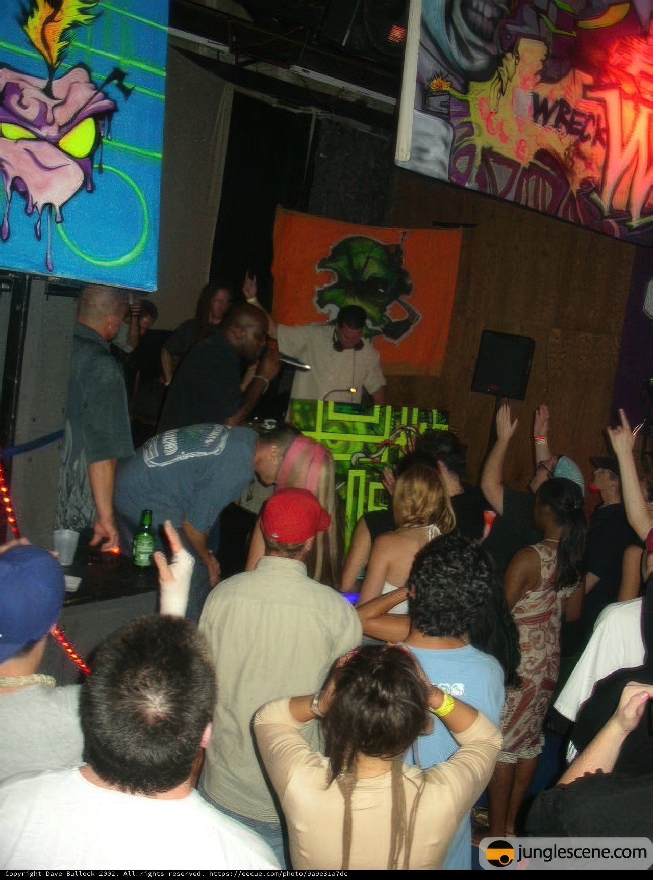 Nightclub Party with DJ and Crowded Audience