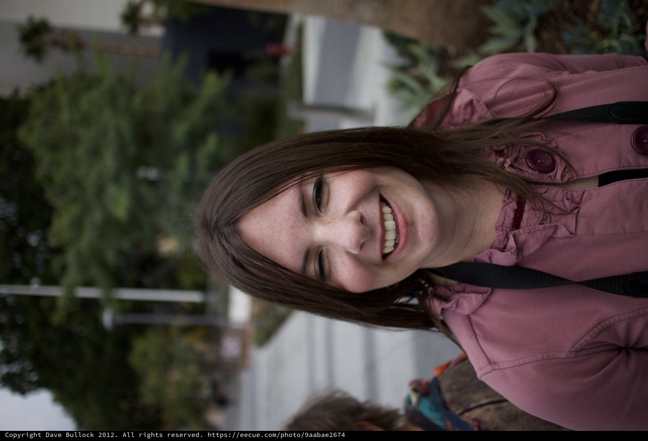 Joyful Woman Laughing Outdoors on Winter Day