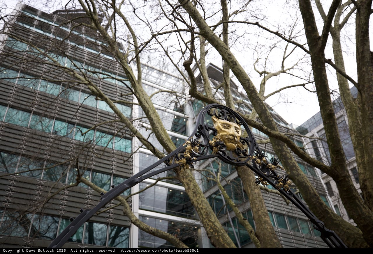Ornate Victorian Lamppost Against Modern London Architecture