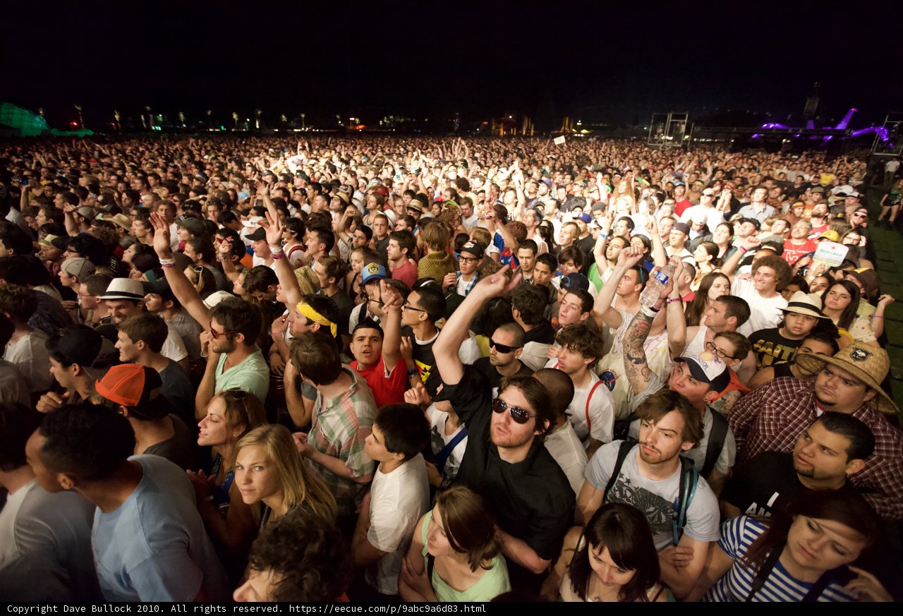 Crowd Dancing under the Night Sky at Coachella Festival