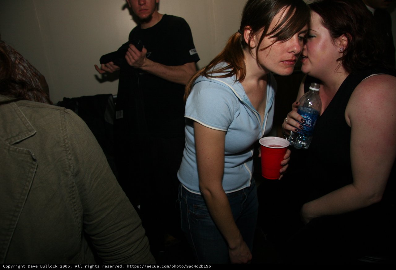 Two Women Conversing at New Year's Eve Party