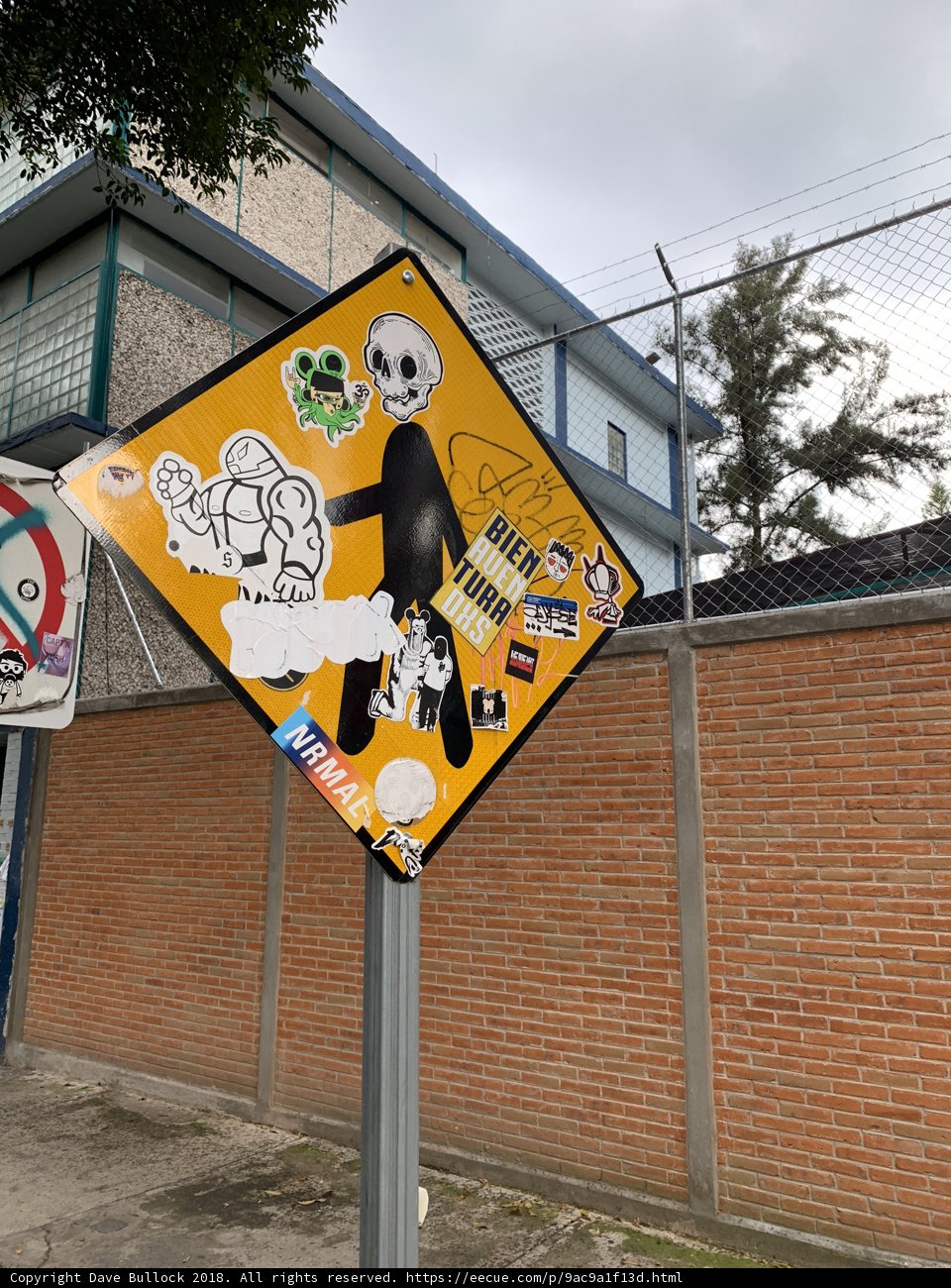Stickered Street Sign