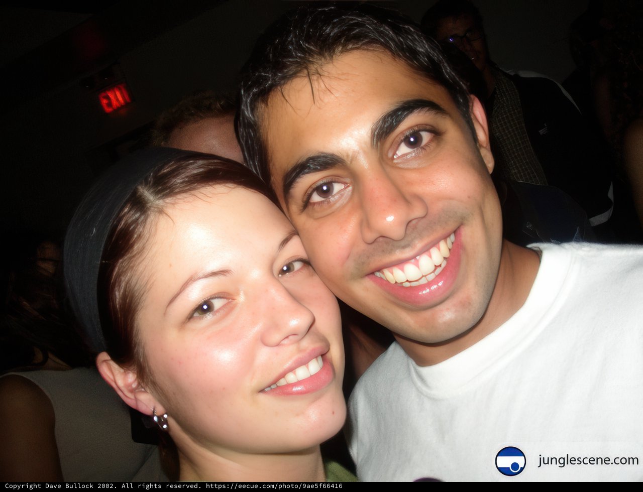 Smiling Couple Wearing Earrings at Wedding