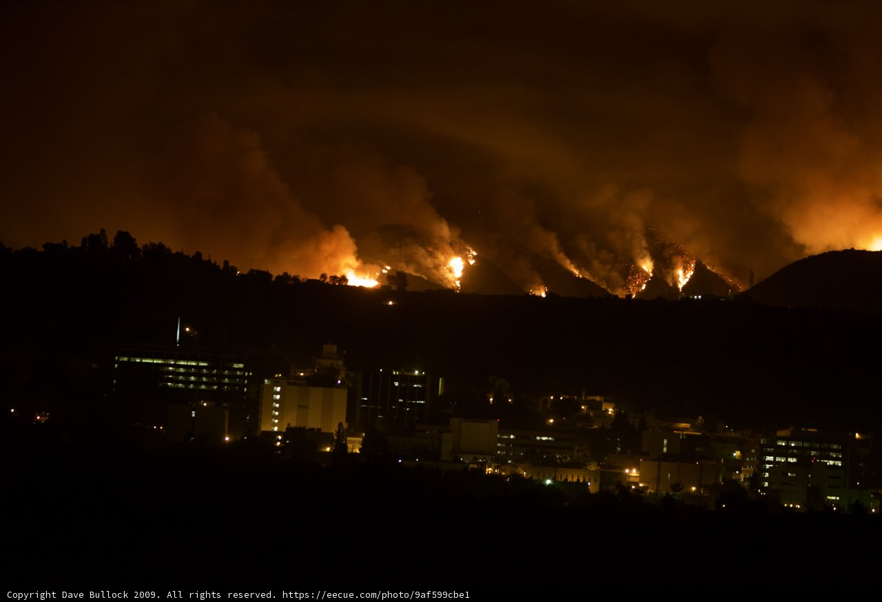 Flames Engulf the Hills Above the City
