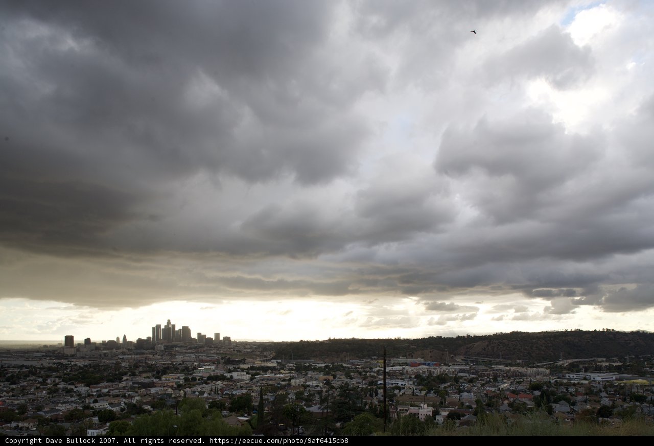 Cumulus Clouds Over Urban Landscape