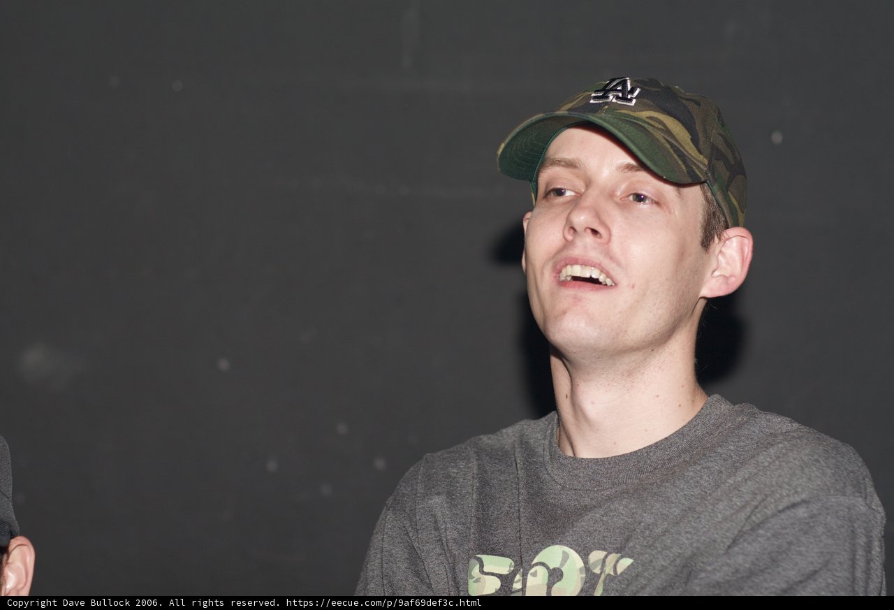 Man in Camo and Two Hats
