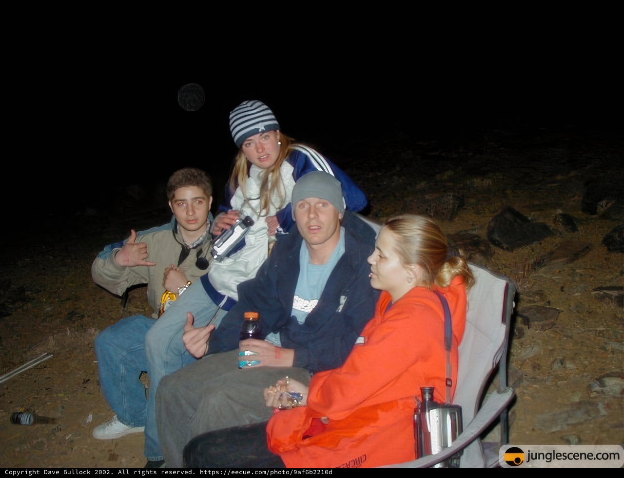 Four People Sitting in the Dark