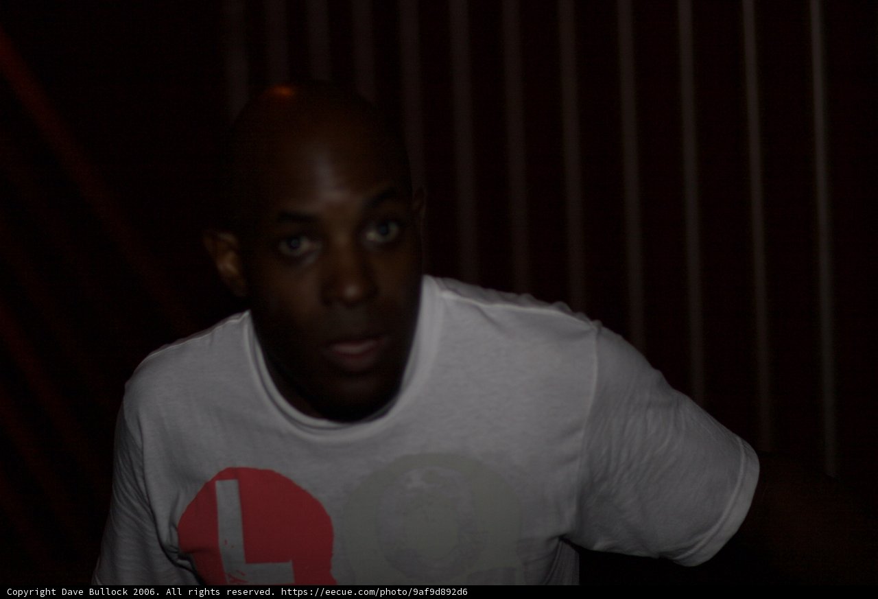 MC Q's Portrait in a White T-Shirt