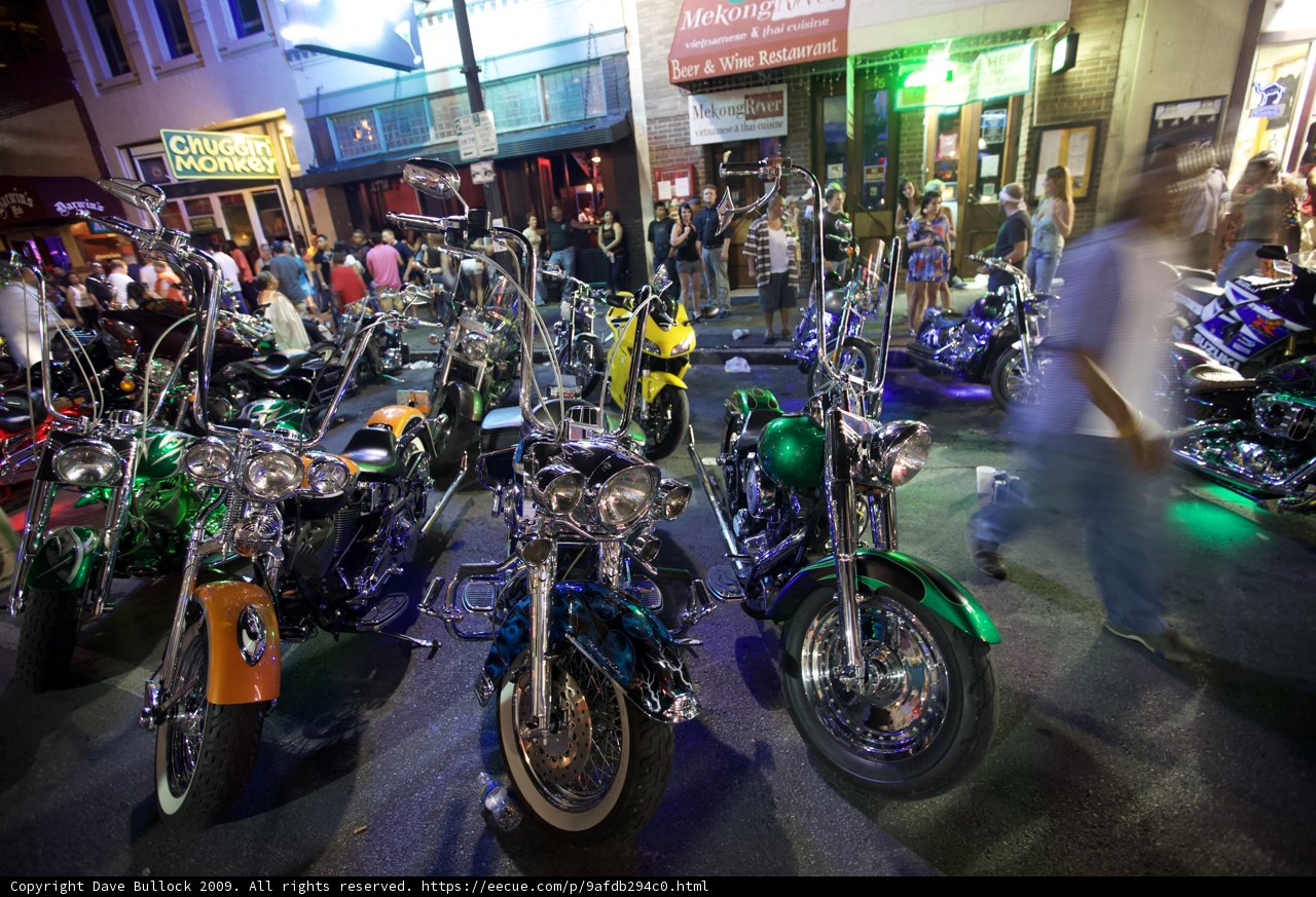 Motorbikes parked outside storefront