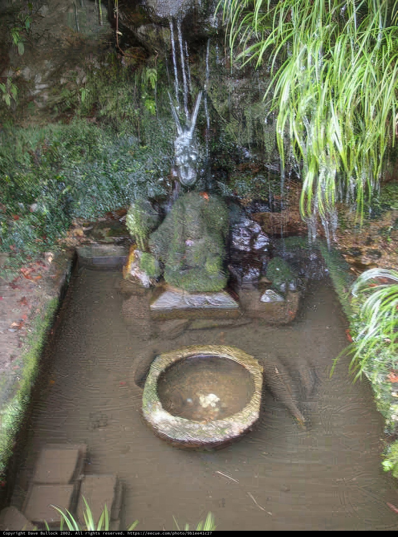 Serene Pond with Buddha Statue