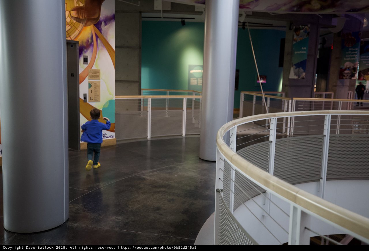 Young Explorer in Modern Science Museum Walkway