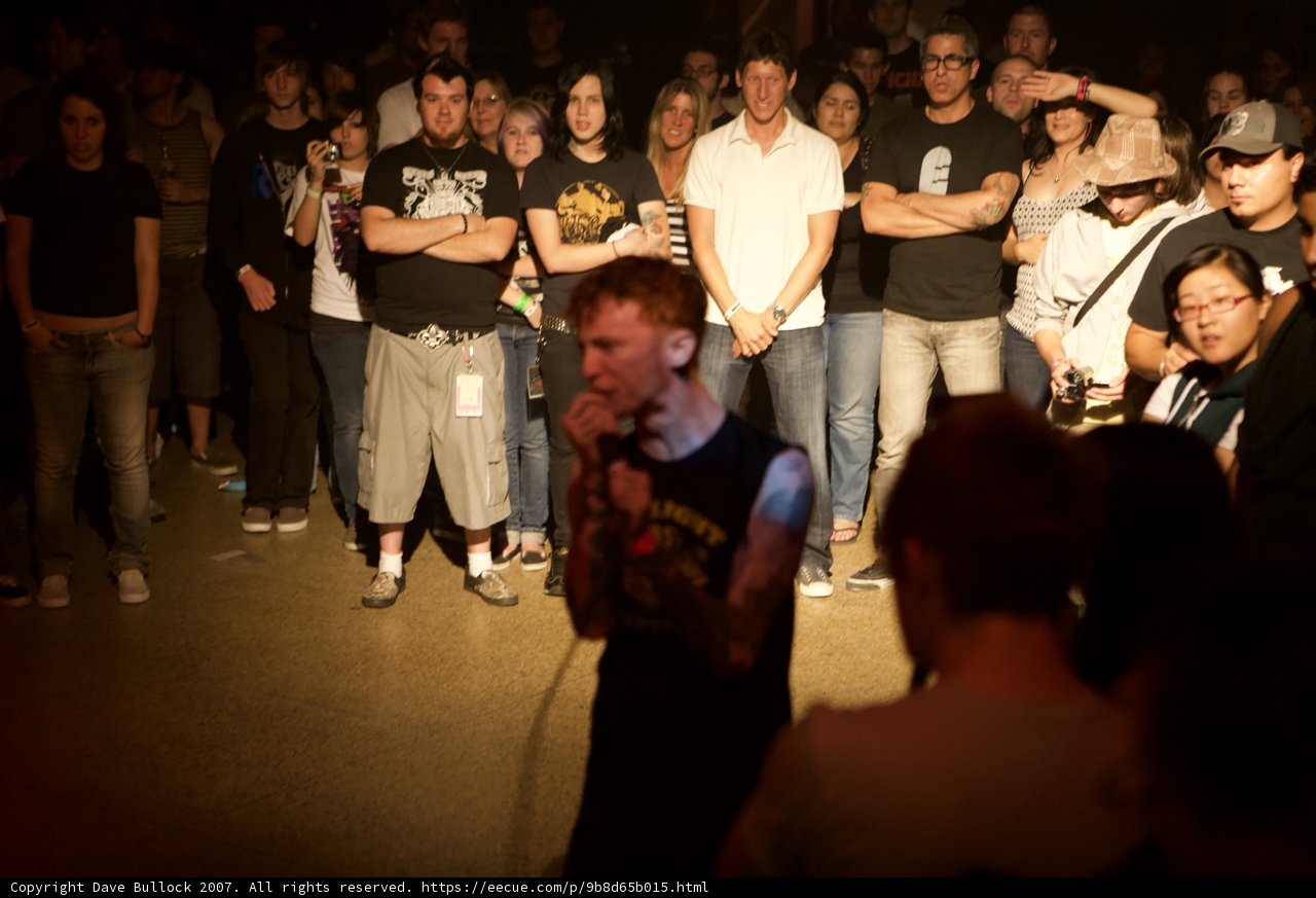 Tattooed Man Rocks Out with Crowd