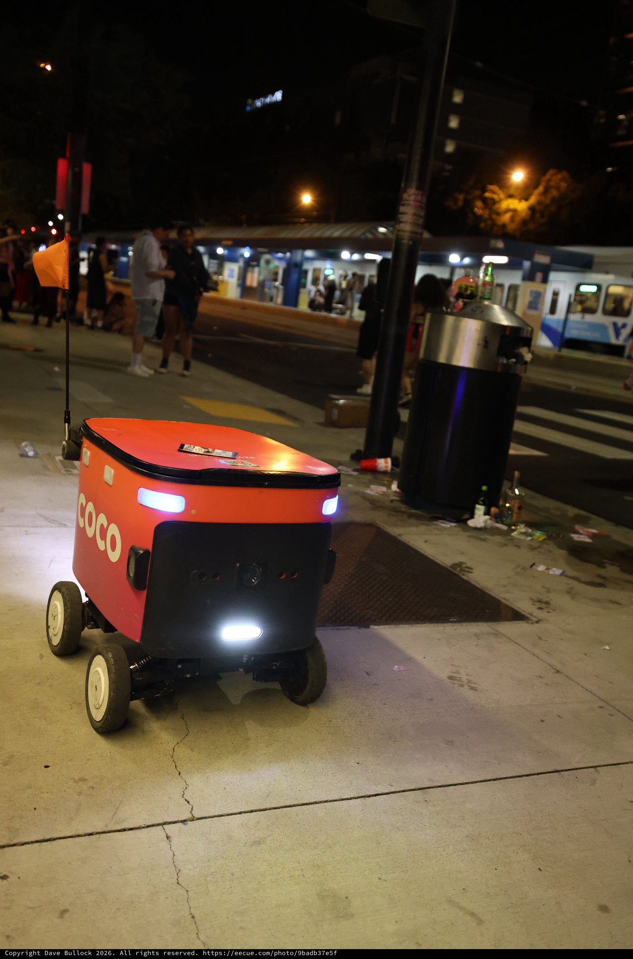 Coco Delivery Robot Navigates Busy City Sidewalk at Night