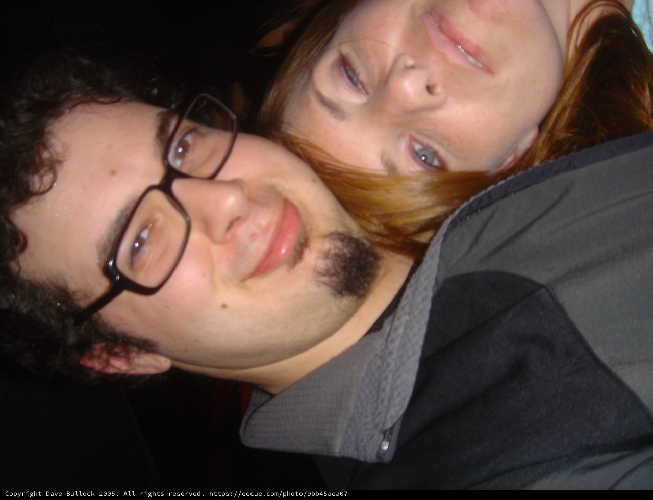 Two Friends Share a Playful Close-Up Selfie