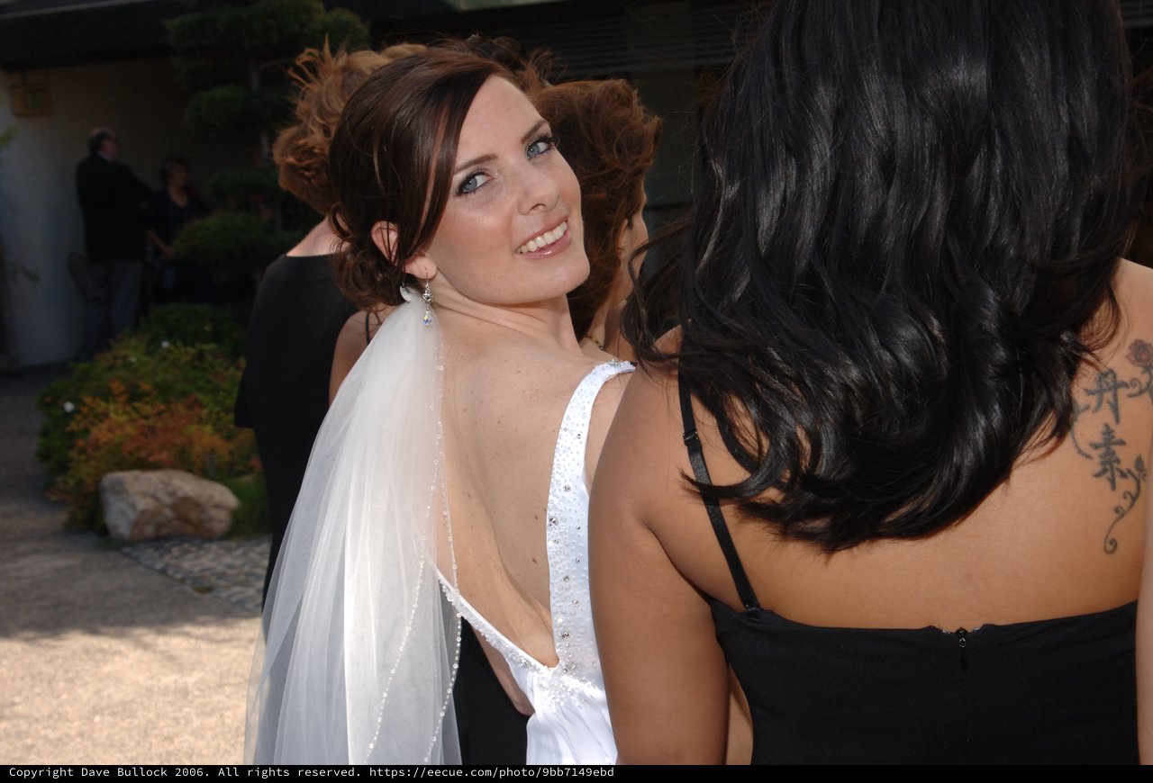 Radiant Bride Glances Back at Wedding Celebration