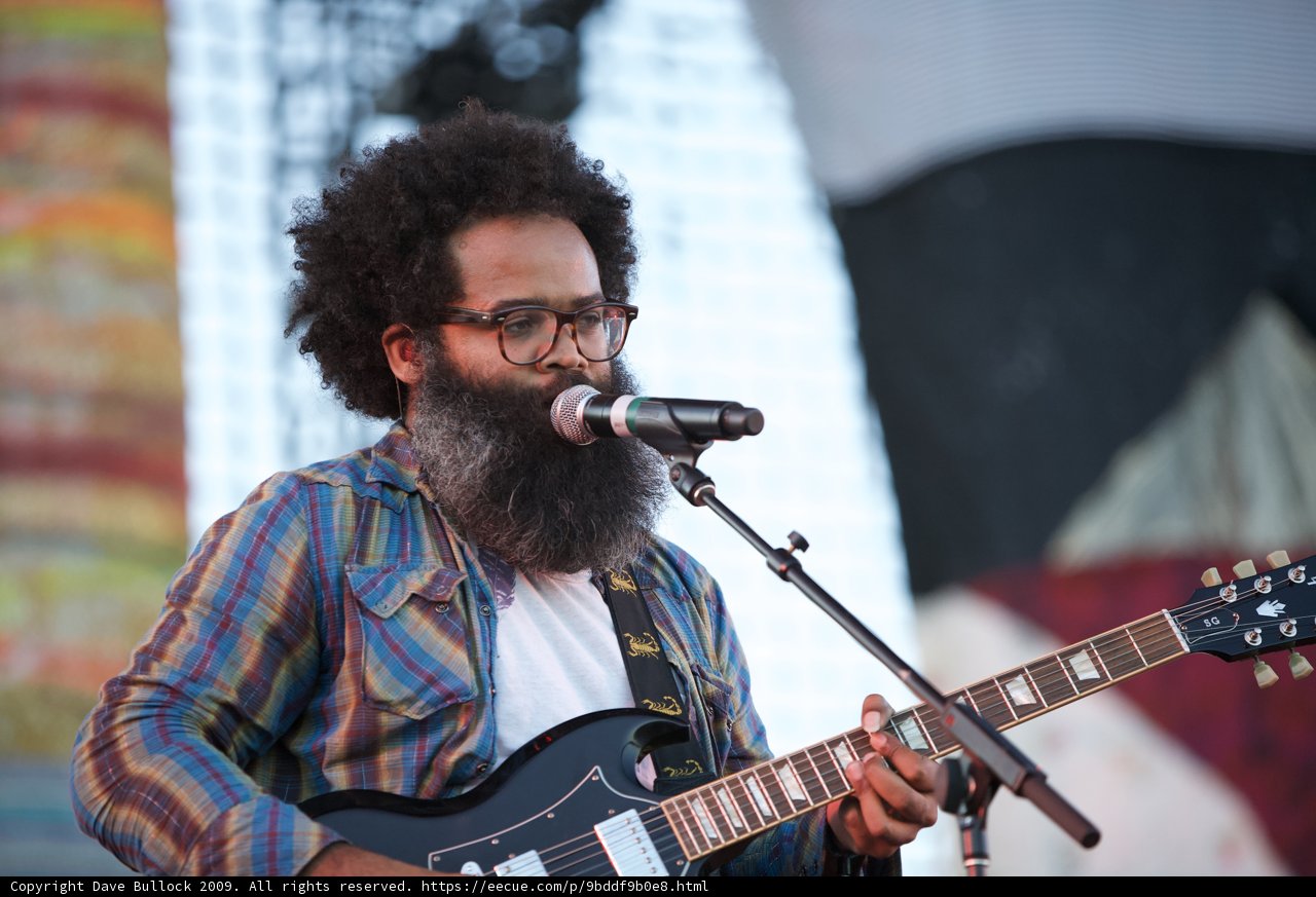Musician Kyp Malone Strums His Guitar