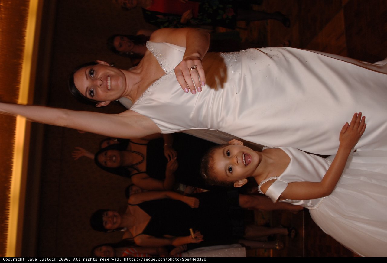 Bride and Flower Girl Celebrate on the Dance Floor