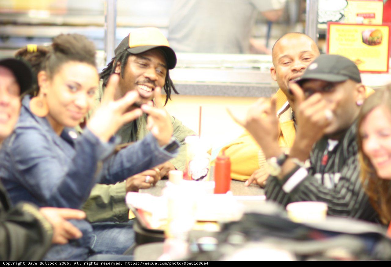 Friends Laughing Together at a Fast Food Restaurant