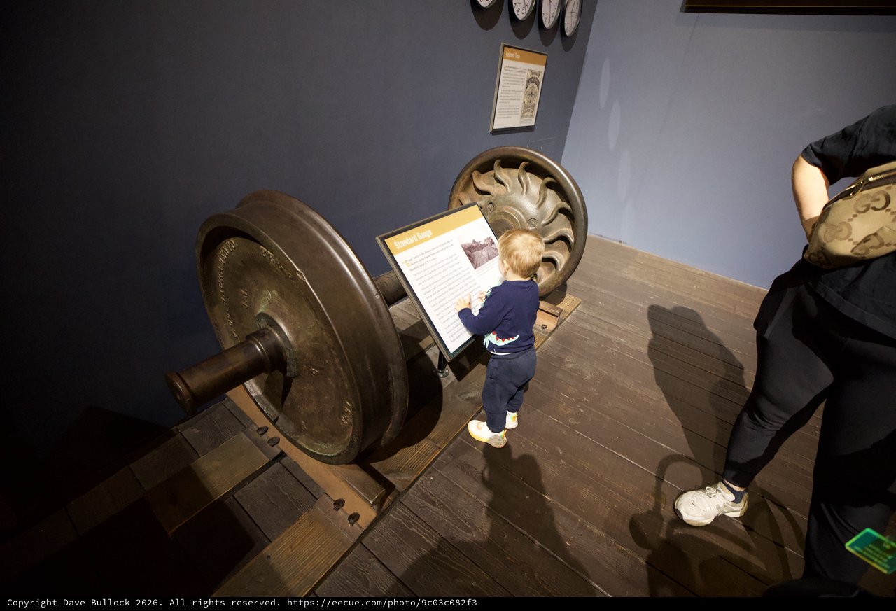 Young Child Explores Interactive Museum Display