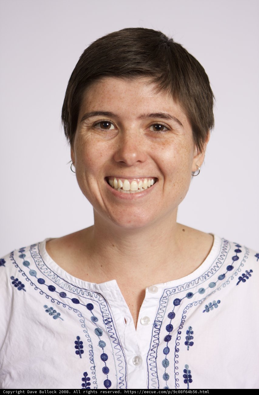 Smiling Woman in White Blouse