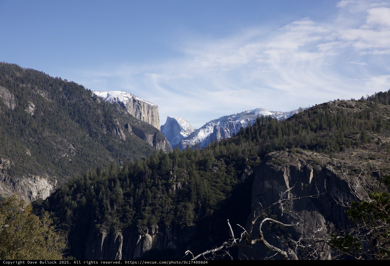 Half Dome Framed by Snowy Granite Cliffs