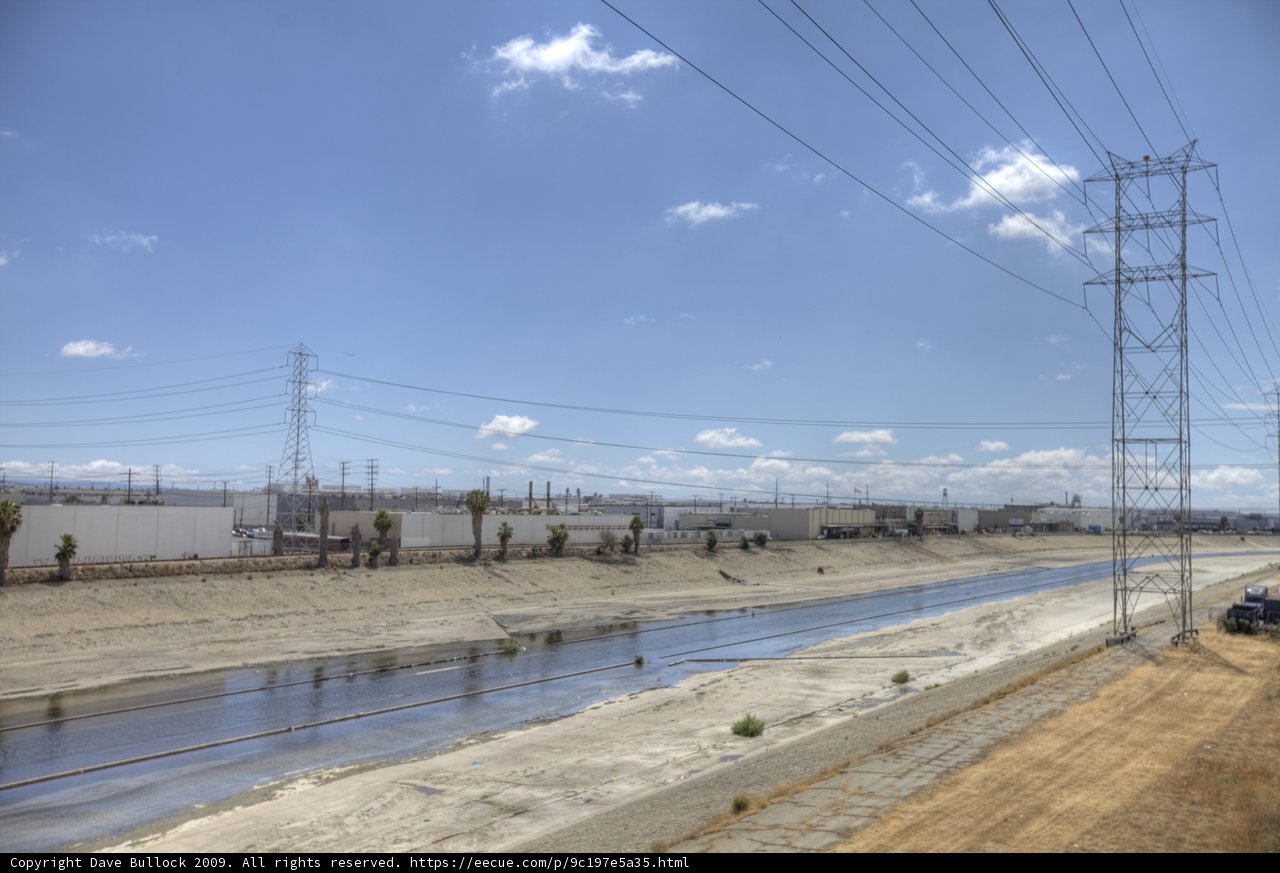 Power lines by the river