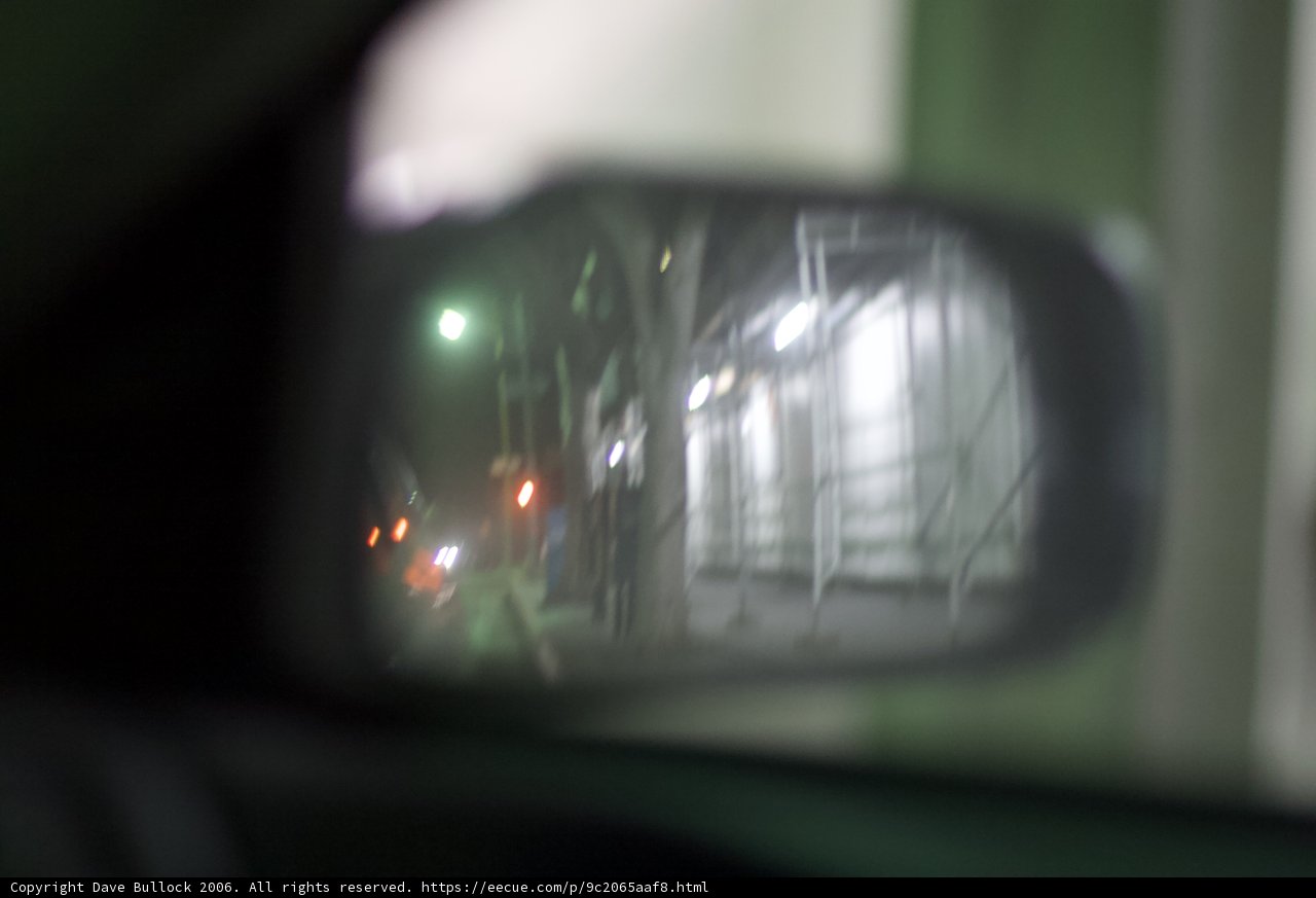 Street Reflection in Car Mirror