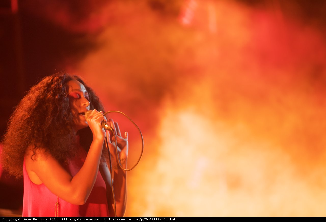 Solange Portrait Expressive Hand Near Mic Heavy Orange Smoke