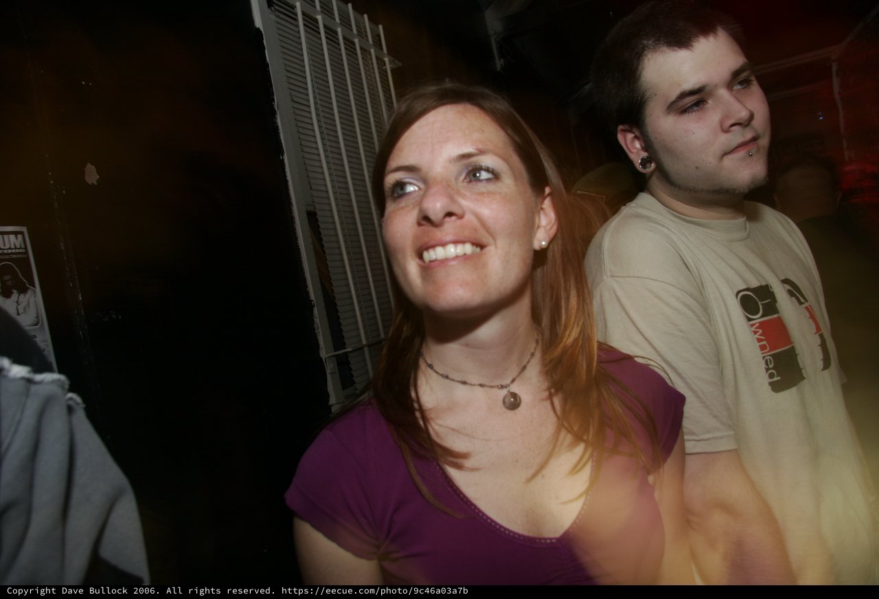 Smiling Woman at Nighttime Outdoor Gathering 2006