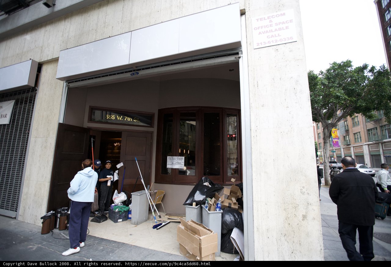 Man Standing Outside of Building