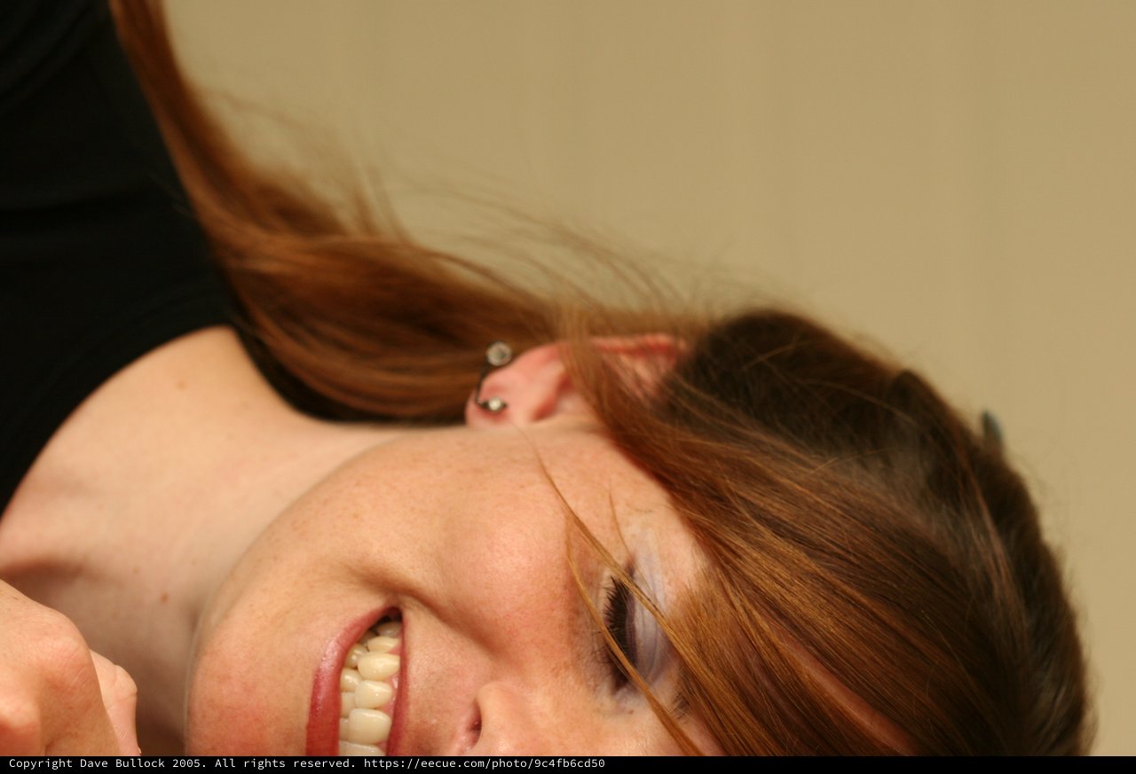 Joyful Portrait of Young Woman with Auburn Hair