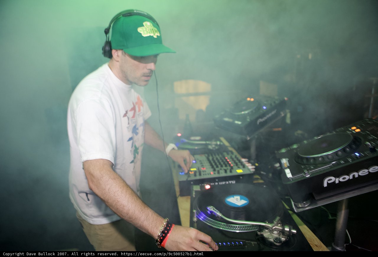 Man in Green Baseball Cap in the Mix