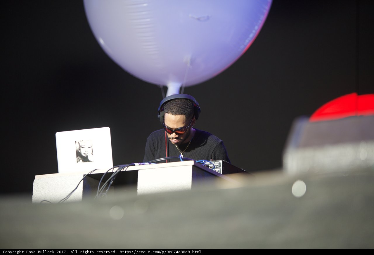 Man on Laptop Surrounded by Balloons at Coachella