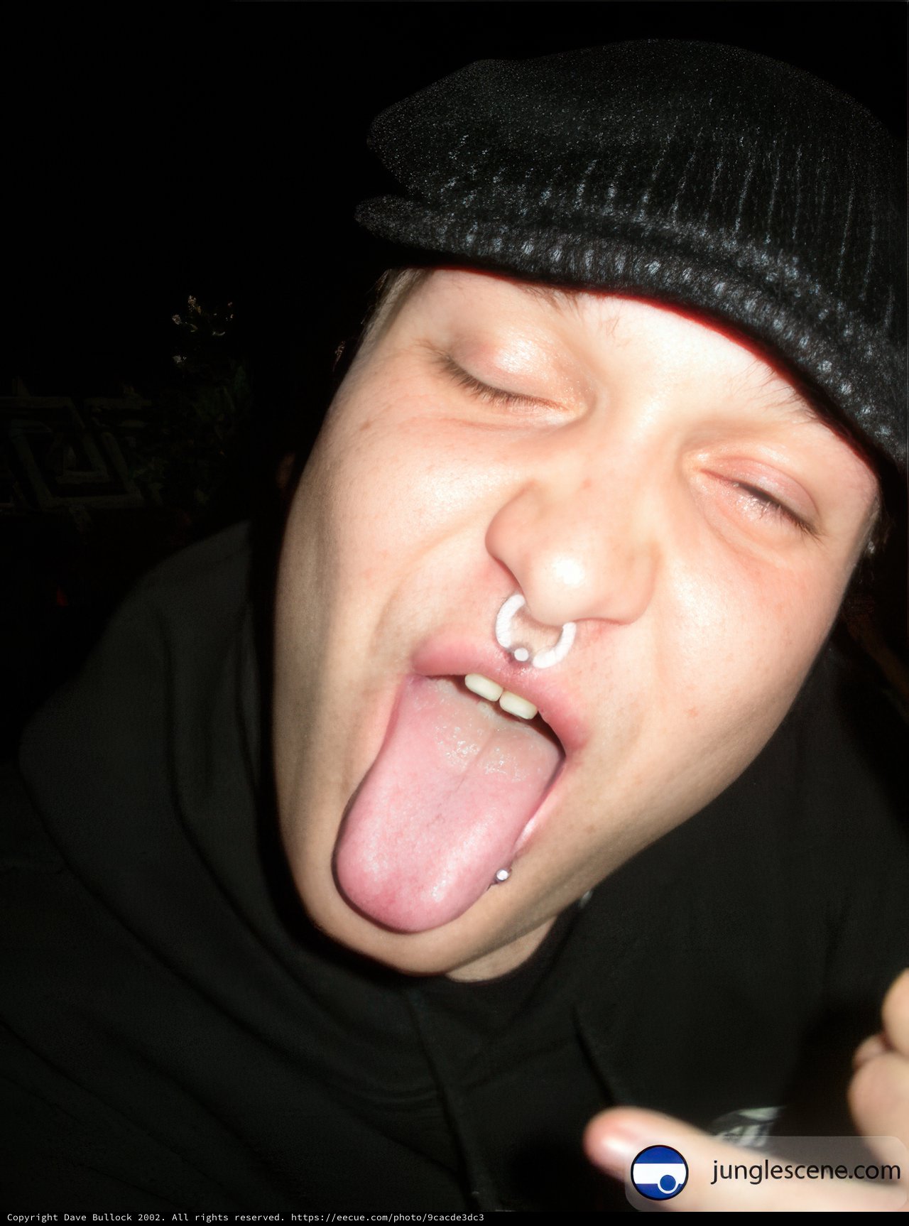 A Man with a Tongue Out and a Beanie Hat