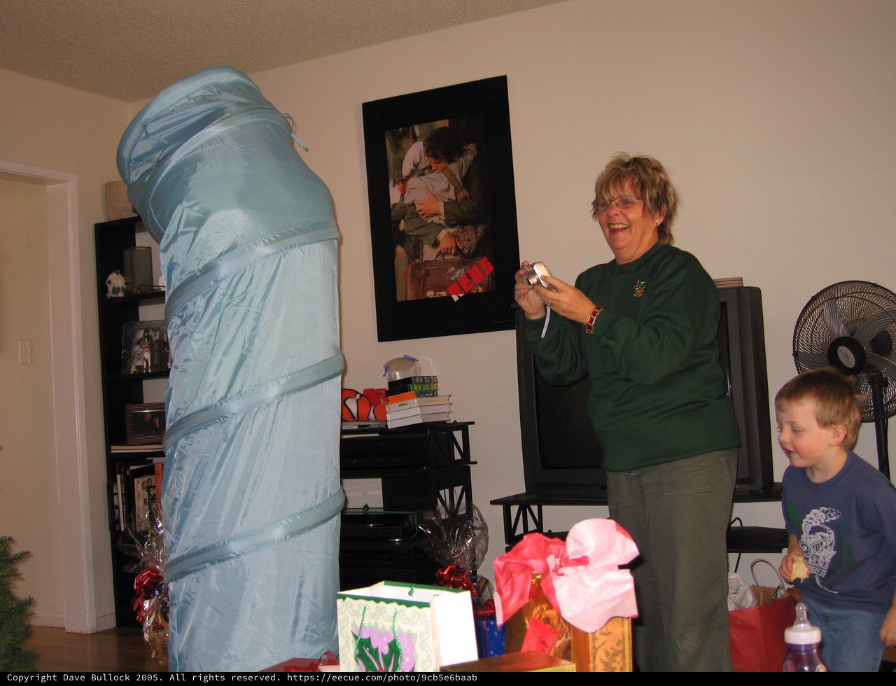 Grandmother Laughing at Enormous Christmas Gift Surprise